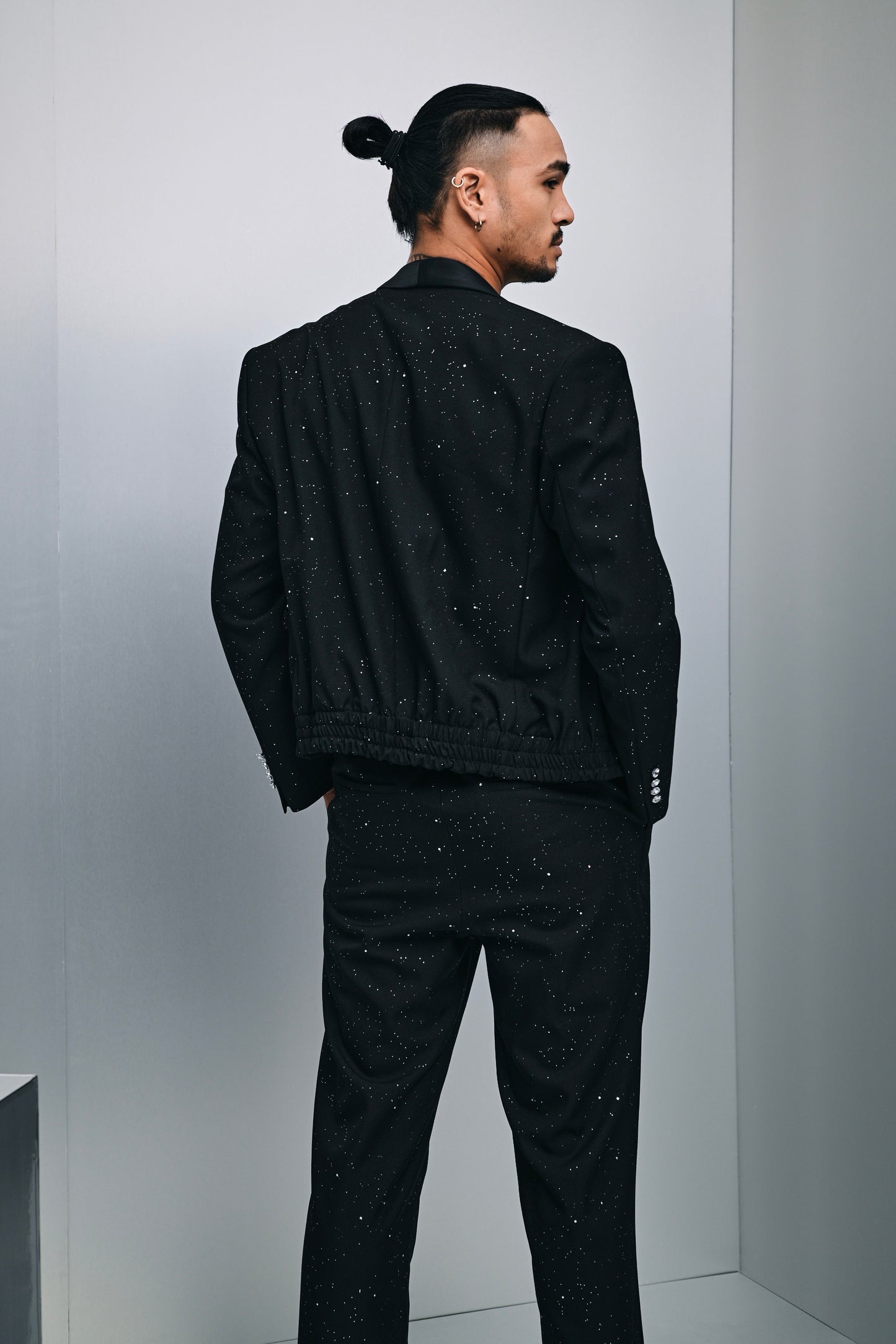 Zander hybrid glitter laminated bomber suit